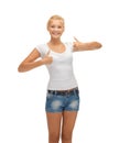 Teenage girl in blank white t-shirt with thumbs up Royalty Free Stock Photo