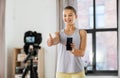 teenage girl or blogger recording gym class video