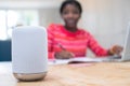 Teenage Girl Doing Homework At Home Asking Digital Assistant Question Royalty Free Stock Photo