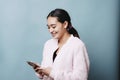 Teenage Girl with Braces Smiles at Her Phone and is Happy Texting Screen Time