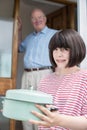 Teenage Girl Bringing Meal For Elderly Male Neighbour