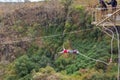 A teenage girl bungee jumping off the Victoria Falls Bridge in Zambia Zimbabwe