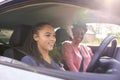 Teenage Girl In Car Having Driving Lesson From Female Instructor Or Parent Royalty Free Stock Photo