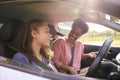 Teenage Girl In Car Having Driving Lesson From Female Instructor Or Parent Royalty Free Stock Photo