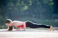 Teenage girl in chaturanga dandasana pose