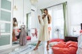 Teenage girl choosing clothing in closet Royalty Free Stock Photo