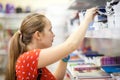 Teenage girl is choosing copybook in bookshop Royalty Free Stock Photo