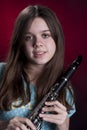 Teenage Girl Clarinet Player on Red Royalty Free Stock Photo