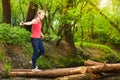 Teenage girl crossing a river to reach other side