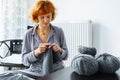 young woman knits wool product Royalty Free Stock Photo