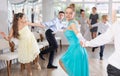 Teenage girl dancing jitterbug with partner during student dance event