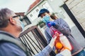 Teenage girl is delivering some groceries to an elderly person, during the epidemic coronovirus Royalty Free Stock Photo