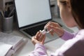 Teenage girl disinfect hands with sanitizer gel