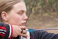 Teenage girl doing archery