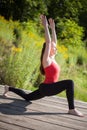 Teenage girl doing Ashva Sanchalasana Royalty Free Stock Photo