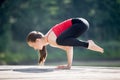 Teenage girl doing Bakasana Pose