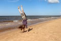 Girl doing handstand on a beach in Latvia Royalty Free Stock Photo