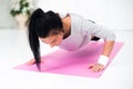 Teenage girl doing push ups warming up working at Royalty Free Stock Photo