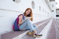 teenage girl draws in the sketchbook while sitting on the steps Royalty Free Stock Photo