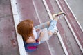 teenage girl draws in the sketchbook while sitting on the steps Royalty Free Stock Photo