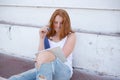 teenage girl draws in the sketchbook while sitting on the steps Royalty Free Stock Photo