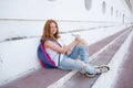 teenage girl draws in the sketchbook while sitting on the steps Royalty Free Stock Photo