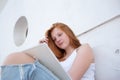 teenage girl draws in the sketchbook while sitting on the steps Royalty Free Stock Photo