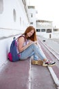teenage girl draws in the sketchbook while sitting on the steps Royalty Free Stock Photo