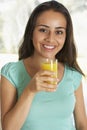 Teenage Girl Drinking Fresh Orange Juice