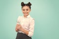 Teenage girl drinking water from glass on isolated blue background. Daily life health. Happy teenager, positive and Royalty Free Stock Photo