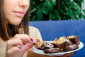 Teenage girl eating chocolate cookies at home Royalty Free Stock Photo