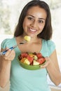 Teenage Girl Eating Fresh Fruit Salad Royalty Free Stock Photo