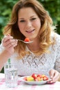 Teenage Girl Eating Healthy Fruit Salad Royalty Free Stock Photo