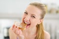 Teenage girl eating toast with chocolate cream Royalty Free Stock Photo