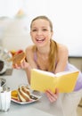 Teenage girl eating toast with chocolate cream Royalty Free Stock Photo