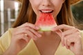 Teenage girl eating watermelon indoors, closeup view Royalty Free Stock Photo