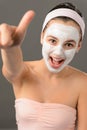 Teenage girl facial mask beauty shouting thumb-up Royalty Free Stock Photo