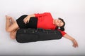 Teenage girl sleeping by violin case Royalty Free Stock Photo