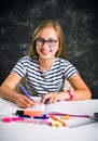 Teenage girl finishing homework at home Royalty Free Stock Photo