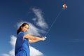 Teenage girl flying a kite Royalty Free Stock Photo