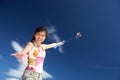 Teenage girl flying a kite Royalty Free Stock Photo