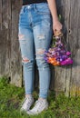 Teenage girl in frayed blue jeans Royalty Free Stock Photo