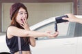 Teenage girl get a new car at garage Royalty Free Stock Photo