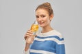 Teenage girl with glass bottle of fruit water Royalty Free Stock Photo