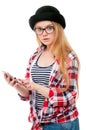 Teenage girl in glasses using cell phone Royalty Free Stock Photo