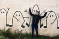 Teenage girl and graffiti wall