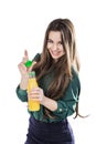 Teenage girl happy while holding a bottle of orange juice.in a green blouse. isolated on a white background.opens a bottle Royalty Free Stock Photo