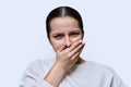 Teenage girl having toothache, on white studio background Royalty Free Stock Photo