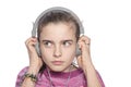 Teenage girl hears something scary on headphones Royalty Free Stock Photo