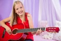 Teenage girl with her guitar Royalty Free Stock Photo